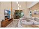 Spacious living room featuring a modern fireplace, comfortable seating, and large sliding glass doors at 7537 Brooklyn Dr, Kissimmee, FL 34747