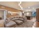 Spacious living room with sectional sofa and fireplace at 7537 Brooklyn Dr, Kissimmee, FL 34747