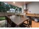 Covered patio with outdoor dining and grill at 7537 Brooklyn Dr, Kissimmee, FL 34747