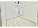 The bedroom features laminate flooring, a ceiling fan, and natural light at 10001 Newington Dr, Orlando, FL 32836