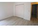Bright bedroom features modern flooring, a closet and fresh paint at 10001 Newington Dr, Orlando, FL 32836