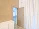 Bedroom featuring modern cabinet, privacy door, and sheer curtain at 10001 Newington Dr, Orlando, FL 32836