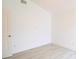 Bright, airy bedroom with light-colored laminate flooring and neutral walls at 10001 Newington Dr, Orlando, FL 32836