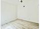 Bright, airy bedroom features neutral walls, laminate floors, and a ceiling fan at 10001 Newington Dr, Orlando, FL 32836