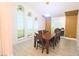 Formal dining room with wood table and chairs, and wood wall accents at 10001 Newington Dr, Orlando, FL 32836