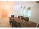 Formal dining room with a large wood table and hardwood floors at 10001 Newington Dr, Orlando, FL 32836