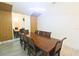 Elegant dining room with wood table and modern light fixture at 10001 Newington Dr, Orlando, FL 32836