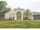 Front view of a house with double doors and landscaping at 10001 Newington Dr, Orlando, FL 32836