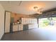 Spacious garage with built-in cabinets and epoxy flooring for ample storage and easy maintenance at 10001 Newington Dr, Orlando, FL 32836