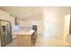 Contemporary kitchen with island, stainless appliances, and sleek white cabinetry at 10001 Newington Dr, Orlando, FL 32836
