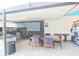 Open-air patio space with a modern outdoor kitchen and dining area at 10001 Newington Dr, Orlando, FL 32836