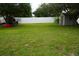 Spacious grassy backyard with shed and privacy fence at 1028 Merrimack Blvd, Davenport, FL 33837