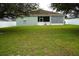 Large backyard with green grass and fenced perimeter at 1028 Merrimack Blvd, Davenport, FL 33837