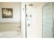Bright bathroom with a walk-in shower and patterned glass door at 1028 Merrimack Blvd, Davenport, FL 33837
