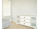 Bedroom with dresser and window with blinds at 1028 Merrimack Blvd, Davenport, FL 33837