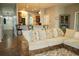 Living room with sectional sofa and view into the kitchen at 1028 Merrimack Blvd, Davenport, FL 33837
