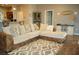 Open concept living room with sectional sofa and kitchen view at 1028 Merrimack Blvd, Davenport, FL 33837