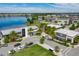 Aerial view of community with lake, shops, and residential buildings at 10425 Folly Beach Rd, Orlando, FL 32827