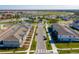 Aerial view of community with lake, fountain, and townhouses at 10425 Folly Beach Rd, Orlando, FL 32827