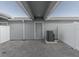 Private backyard with paver patio and gray siding, AC unit visible at 10425 Folly Beach Rd, Orlando, FL 32827