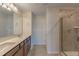 Double vanity bathroom with large shower at 10425 Folly Beach Rd, Orlando, FL 32827