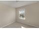 Well-lit bedroom with carpet and window at 10425 Folly Beach Rd, Orlando, FL 32827