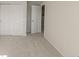 Spacious bedroom with carpet flooring and double doors leading to the closet at 10425 Folly Beach Rd, Orlando, FL 32827