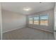 Spacious bedroom with carpet and multiple windows at 10425 Folly Beach Rd, Orlando, FL 32827