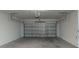 Attached garage with automatic opener and concrete floor at 10425 Folly Beach Rd, Orlando, FL 32827