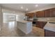 Open concept kitchen with island and stainless steel appliances at 10425 Folly Beach Rd, Orlando, FL 32827
