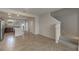 Living room with view of kitchen and staircase at 10425 Folly Beach Rd, Orlando, FL 32827