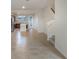 Open concept main living area features kitchen, stairs, and tile flooring at 10425 Folly Beach Rd, Orlando, FL 32827