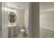 Convenient half bathroom with pedestal sink and toilet at 10425 Folly Beach Rd, Orlando, FL 32827