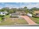 House with solar panels, RV, and boat in driveway at 109 Arrowhead Ln, Haines City, FL 33844