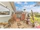 Landscaped backyard with brick patio and fountain at 109 Arrowhead Ln, Haines City, FL 33844