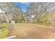 Large backyard with mature trees and open space at 109 Arrowhead Ln, Haines City, FL 33844