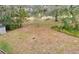 Large backyard with mature trees and shed at 109 Arrowhead Ln, Haines City, FL 33844
