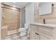 Updated bathroom with walk-in shower, built-in seat, and stylish vanity at 109 Arrowhead Ln, Haines City, FL 33844