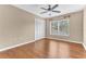 Well-lit bedroom with hardwood floors and ample closet space at 109 Arrowhead Ln, Haines City, FL 33844