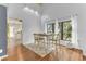Dining area with hardwood floors and view of kitchen at 109 Arrowhead Ln, Haines City, FL 33844