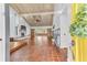 Bright entryway with yellow door and view into living room at 109 Arrowhead Ln, Haines City, FL 33844