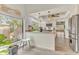 Modern kitchen with breakfast bar and granite countertops at 109 Arrowhead Ln, Haines City, FL 33844