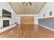 Living room with hardwood floors, fireplace and barn doors at 109 Arrowhead Ln, Haines City, FL 33844