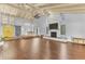 Large living area with hardwood floors, fireplace, and high ceilings at 109 Arrowhead Ln, Haines City, FL 33844