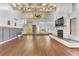 Spacious living room with hardwood floors and a fireplace at 109 Arrowhead Ln, Haines City, FL 33844
