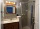 Bathroom with shower, vanity, and tiled walls at 1090 Dean St, St Cloud, FL 34771