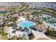 Aerial view of community pool, clubhouse, and homes at 1138 Kingsbarn St, Davenport, FL 33896