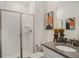 Clean bathroom with walk-in shower and gray vanity at 1138 Kingsbarn St, Davenport, FL 33896