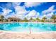 Relaxing circular pool with a swim-up bar and lounge chairs at 1138 Kingsbarn St, Davenport, FL 33896