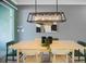 Dining room with light wood table and green chairs at 1138 Kingsbarn St, Davenport, FL 33896